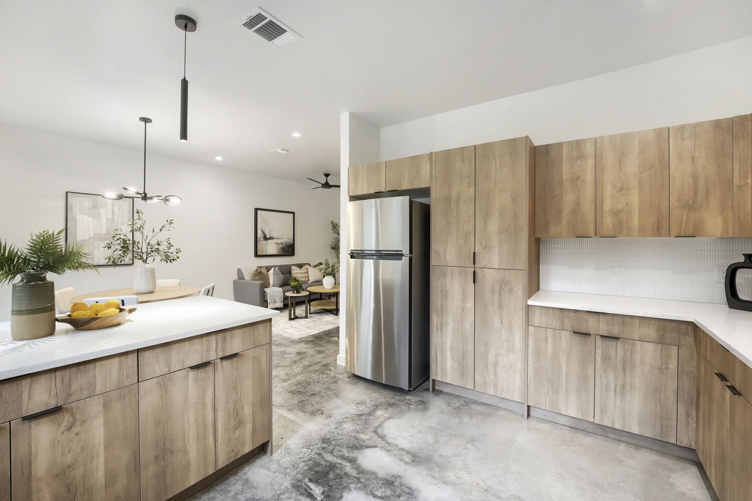 4805 Sara Drive Austin, TX 78721 - Photo 12 of 28 a kitchen with refrigerator and cabinets