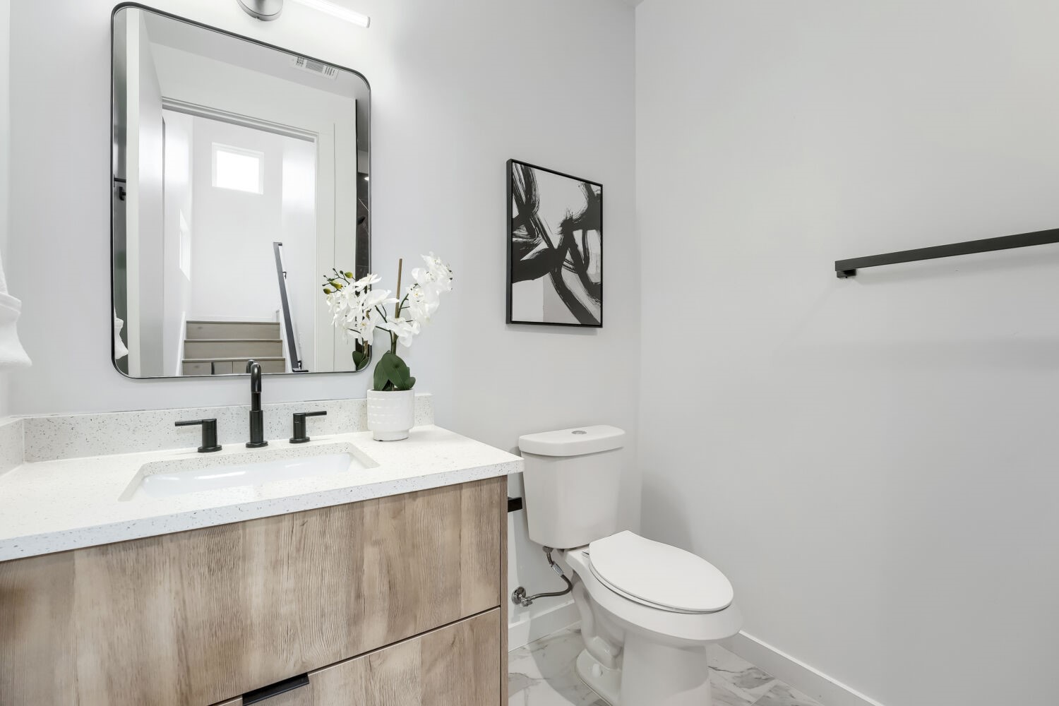 4805 Sara Drive Austin, TX 78721 - Photo 16 of 28 a bathroom with a toilet sink and mirror