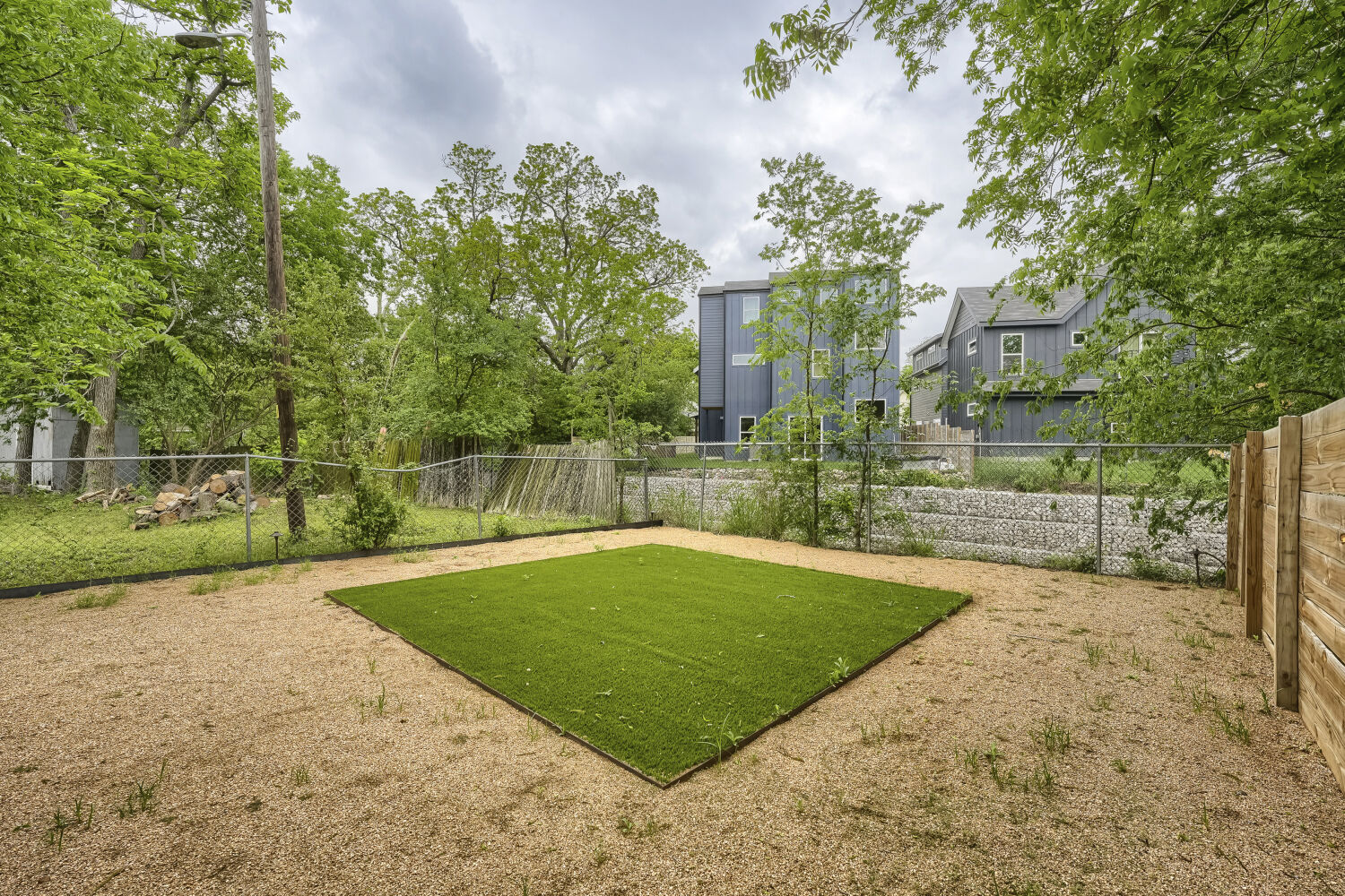 4805 Sara Drive Austin, TX 78721 - Photo 25 of 28 a view of a backyard with large trees