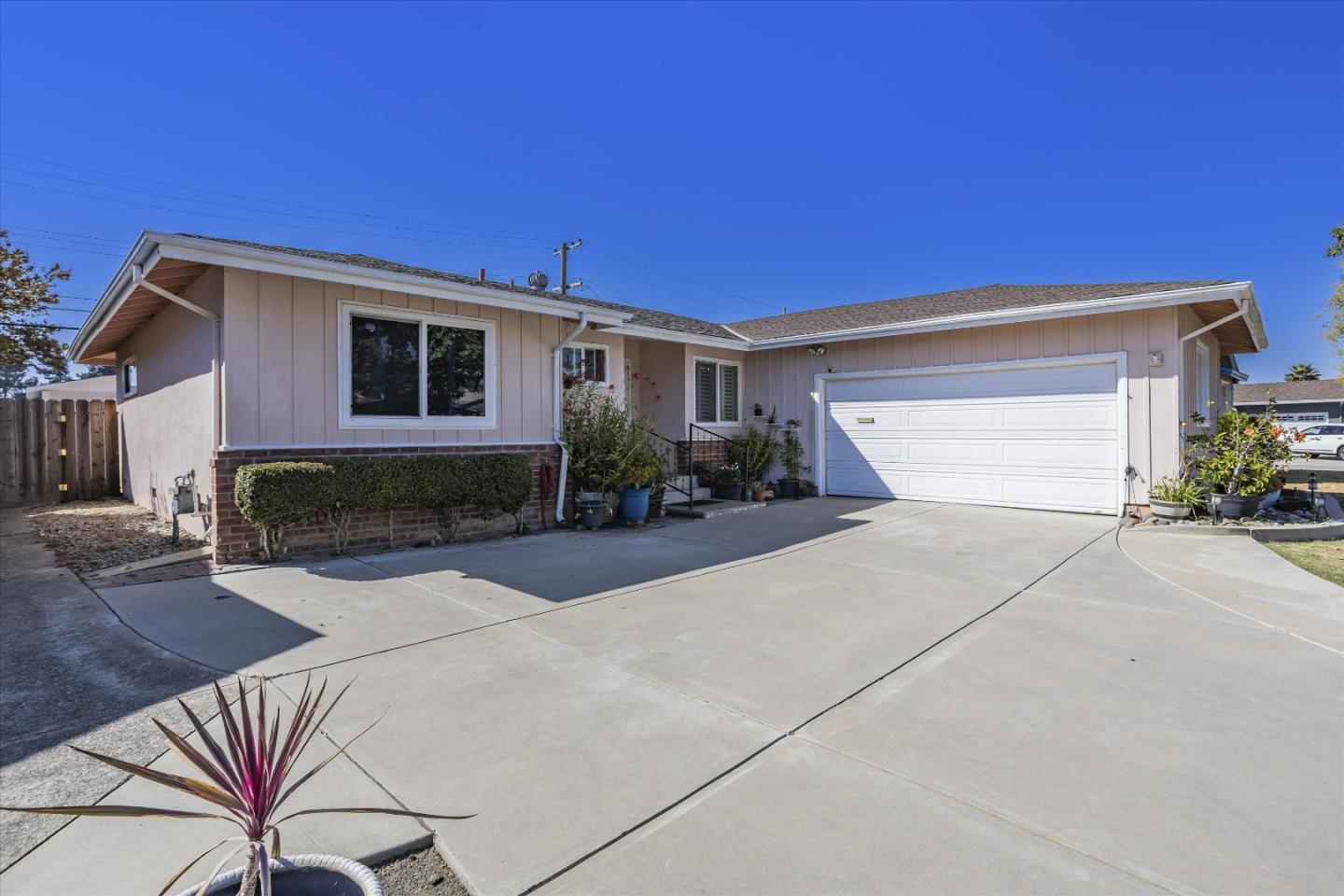 55 Casper Street Milpitas, CA 95035 - Photo 1 of 1 a front view of a house with garden