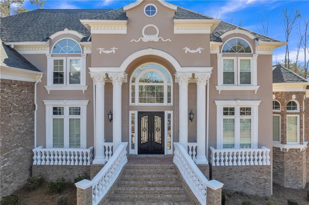 a view of a brick house with a large windows