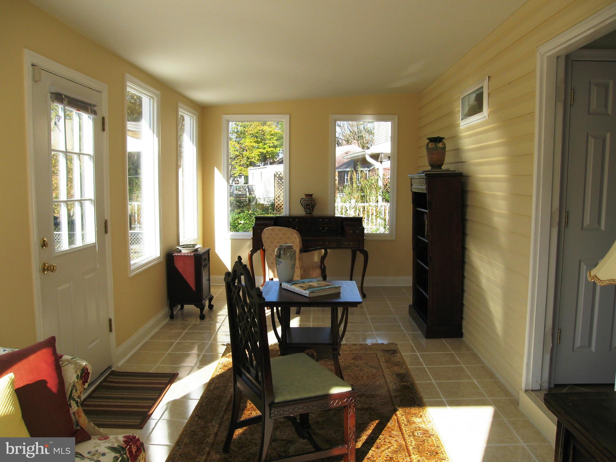 2508 Weisman Road Silver Spring, MD 20902 - Photo 8 of 16 a view of a dining room with furniture window and outside view