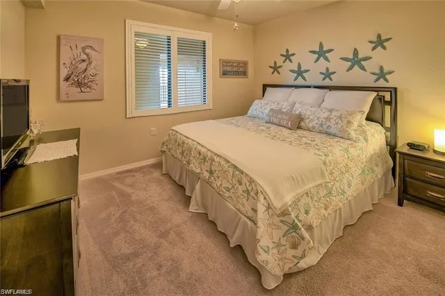 a spacious bedroom with a bed and a window