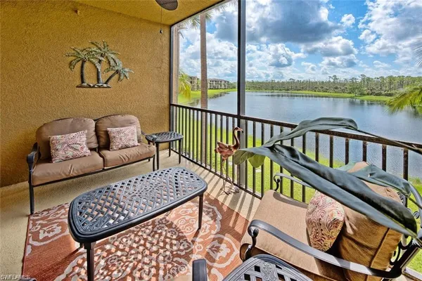 a view of a balcony with furniture