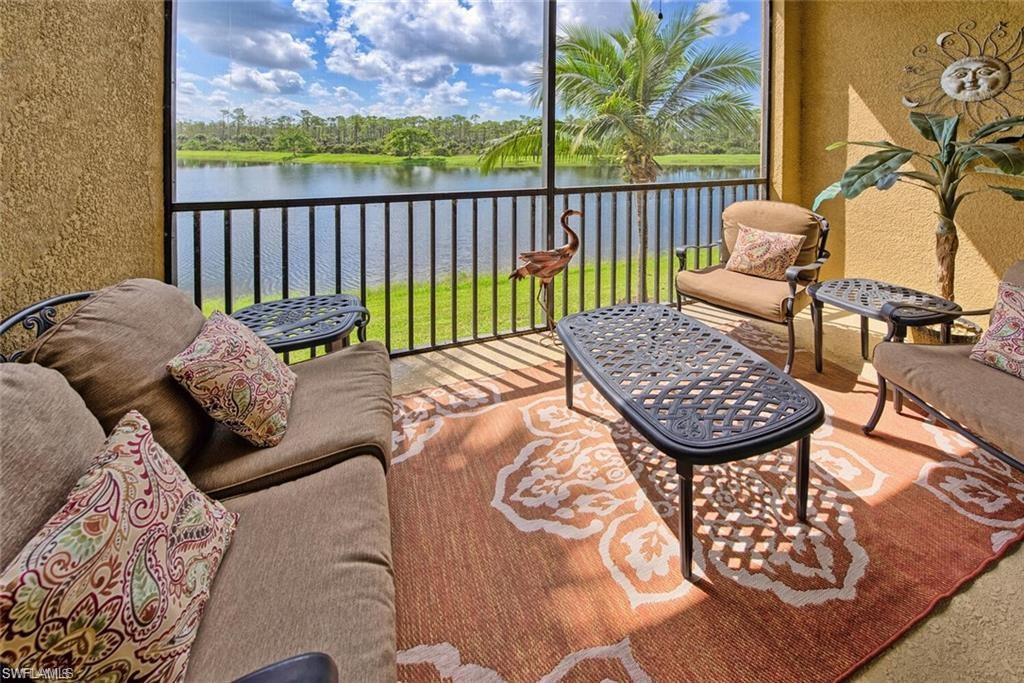 9731 Acqua Court, Unit 525 Naples, FL 34113 - Photo 18 of 35 Sunroom / solarium with a water view