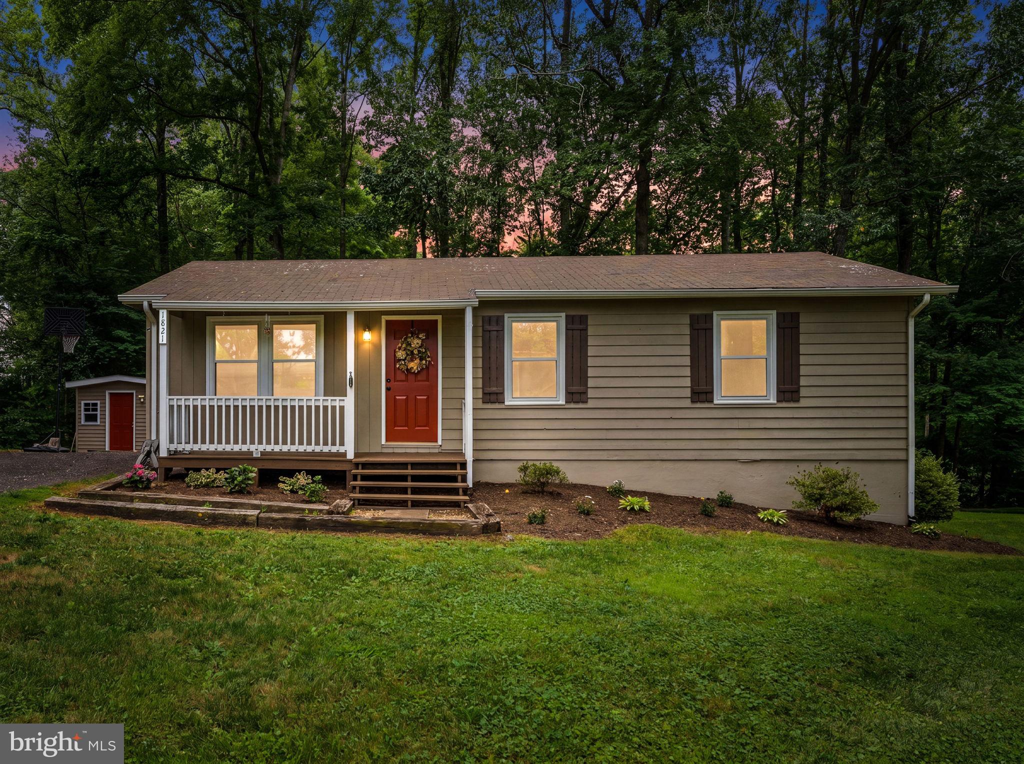 1821 James City Road Reva, VA 22735 - Photo 2 of 44 a front view of a house with a yard