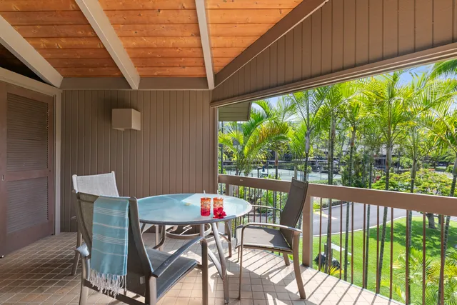 a view of a patio with a table and chairs