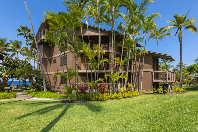a view of swimming pool with a garden and trees