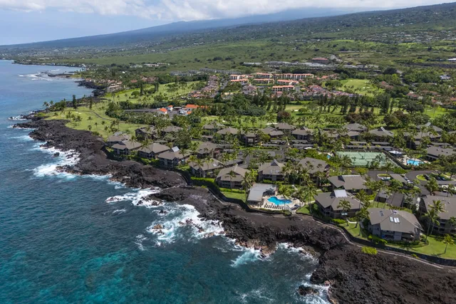 a view of swimming pool with chairs