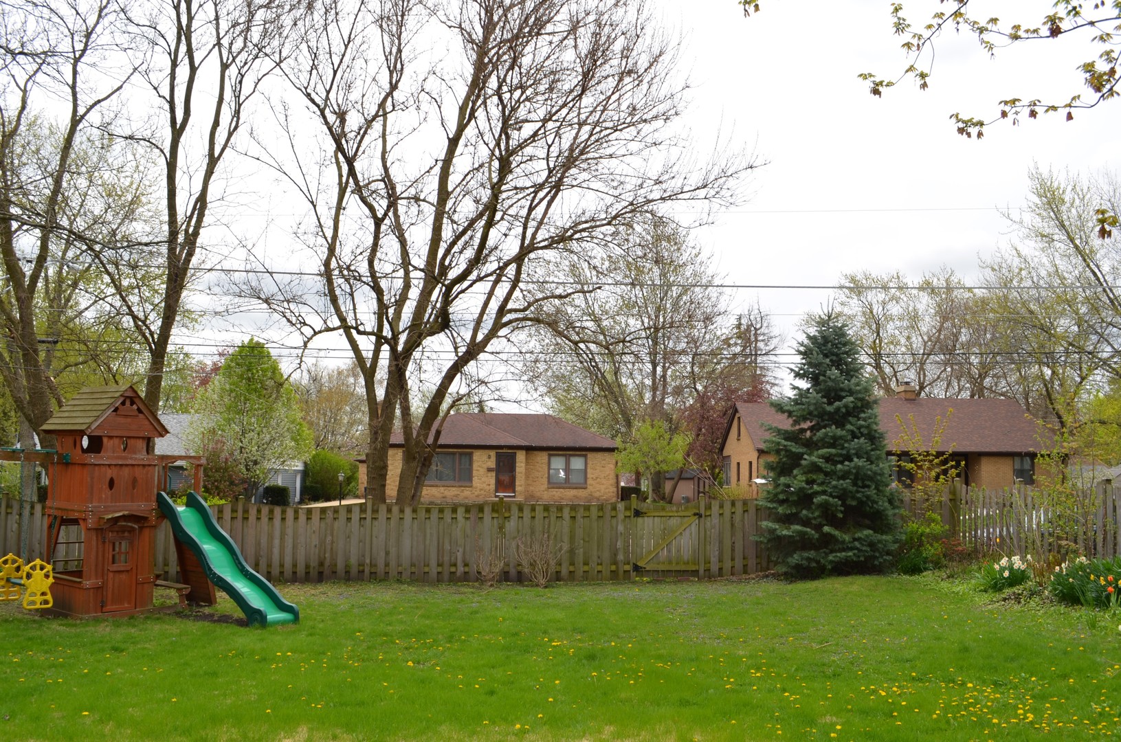 825 Oak Street Elgin, IL 60123 - Photo 15 of 17 a view of a house with a yard