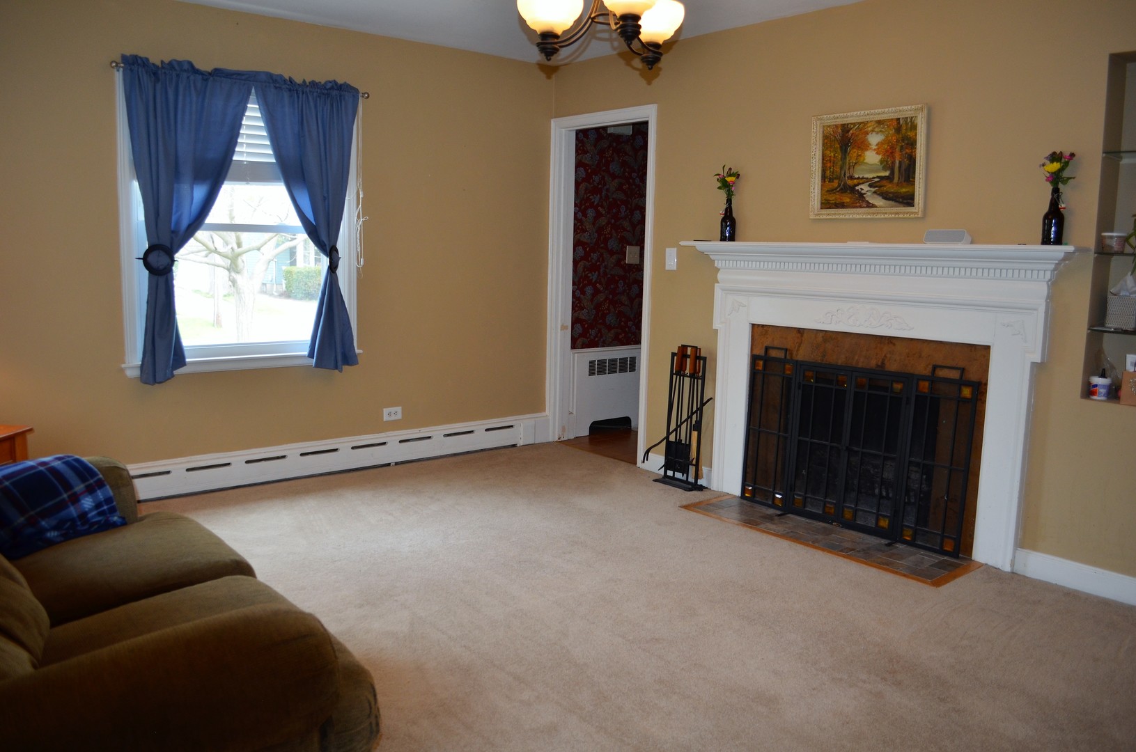 825 Oak Street Elgin, IL 60123 - Photo 3 of 17 a living room with furniture and a fireplace