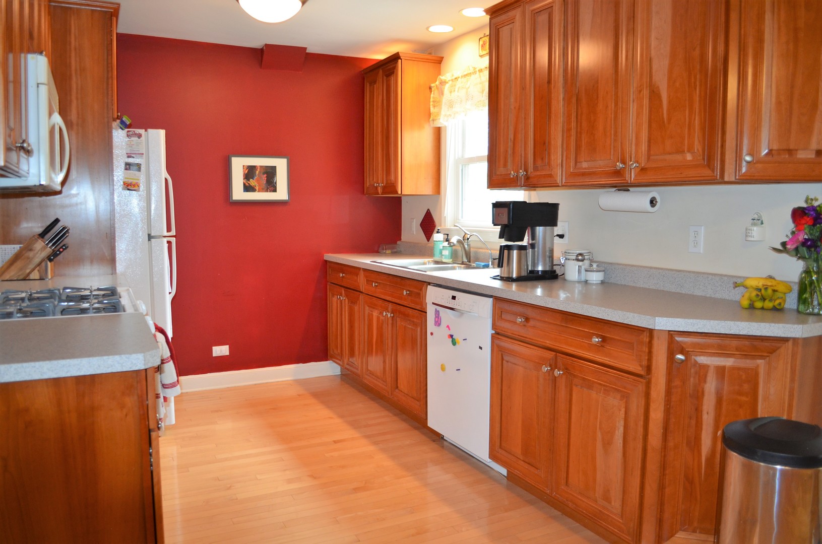 825 Oak Street Elgin, IL 60123 - Photo 5 of 17 a kitchen with stainless steel appliances granite countertop a sink stove and refrigerator