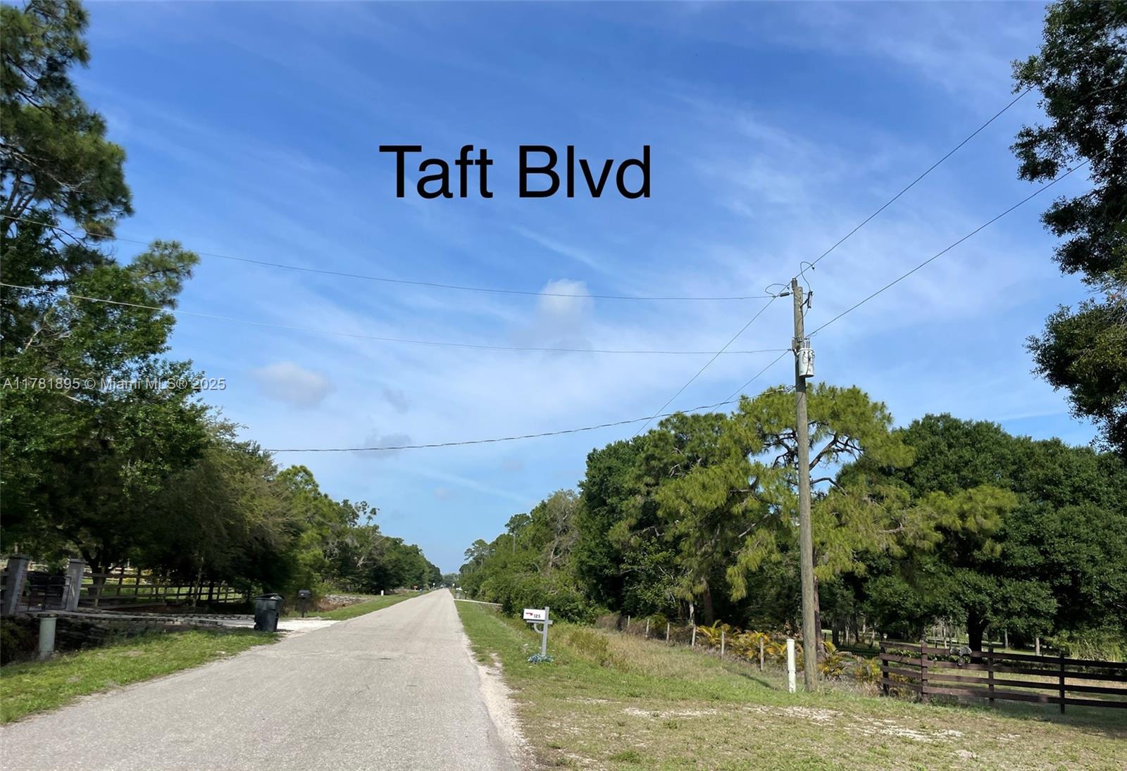 161 Taft Boulevard Clewiston, FL 33440 - Photo 2 of 11 a sign board with a house in the background