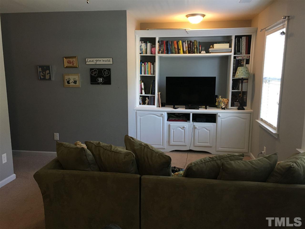 1412 Shady Rise Glen Raleigh, NC 27603 - Photo 20 of 25 Large bonus room with built in cabinets! Lots of storage space.