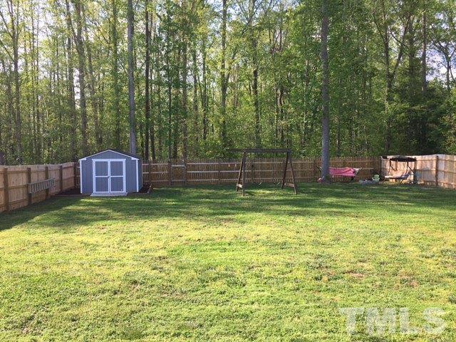 1412 Shady Rise Glen Raleigh, NC 27603 - Photo 23 of 25 Large flat back yard. Plenty of room for entertaining!