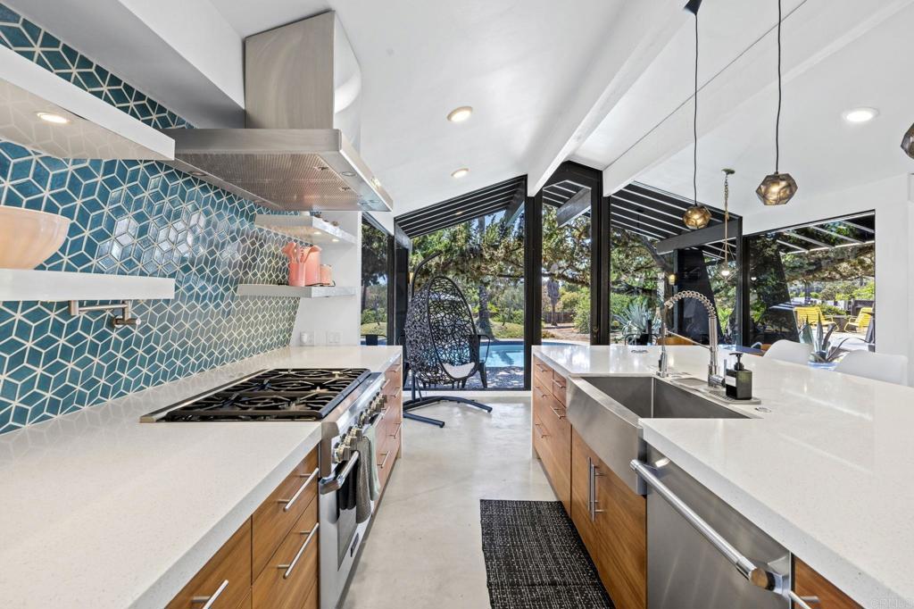 754 El Rancho Drive El Cajon, CA 92019 - Photo 8 of 55 a kitchen that has a sink and a stove