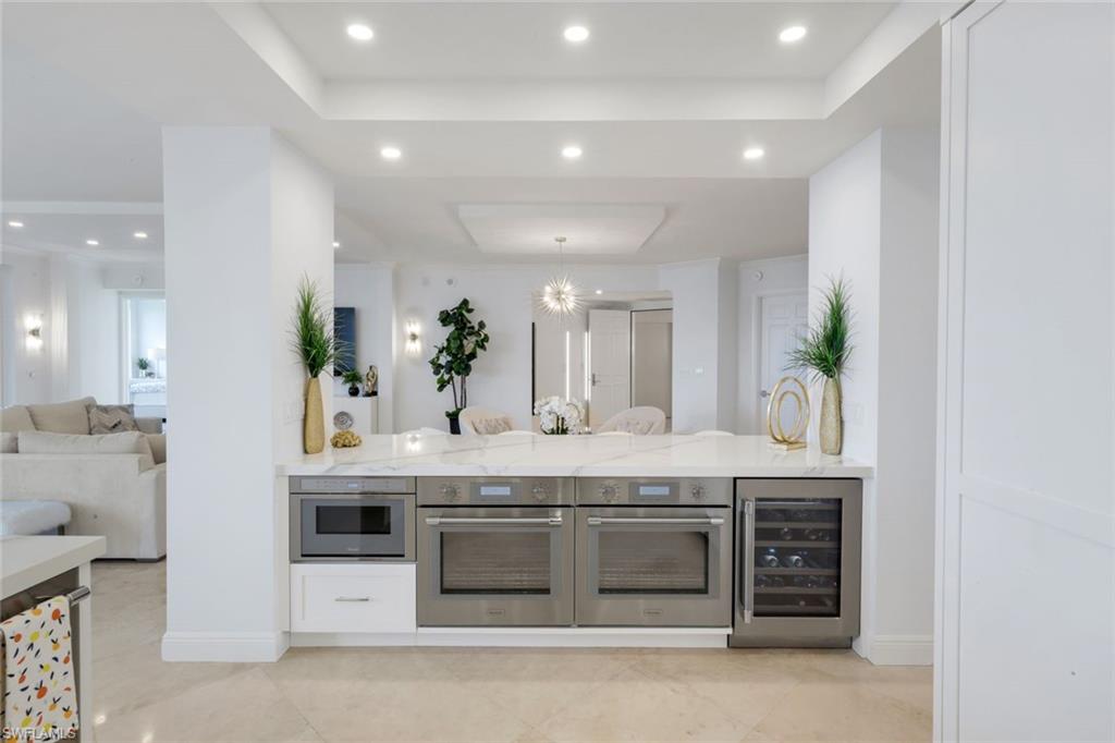 275 Indies Way, Unit 1503 Naples, FL 34110 - Photo 12 of 49 Double Ovens and Beverage Cooler on Island