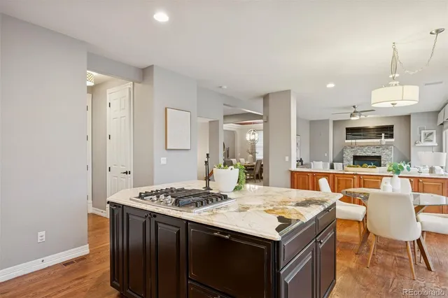 a kitchen that has a table and chairs in it