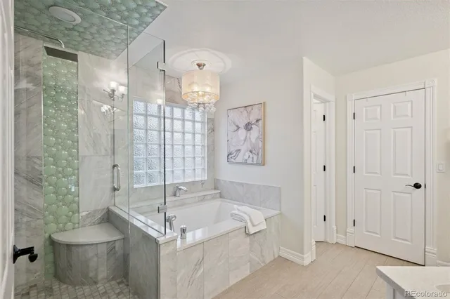 a spacious bathroom with a bathtub and shower