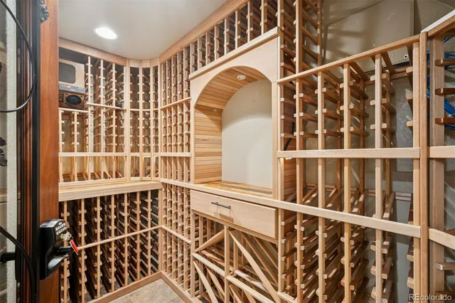 an empty room with a cabinet and mirrors