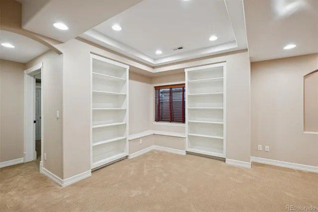 a bathroom with a granite countertop toilet a sink and a mirror