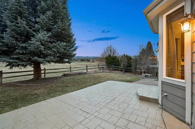 a view of backyard with outdoor and trees