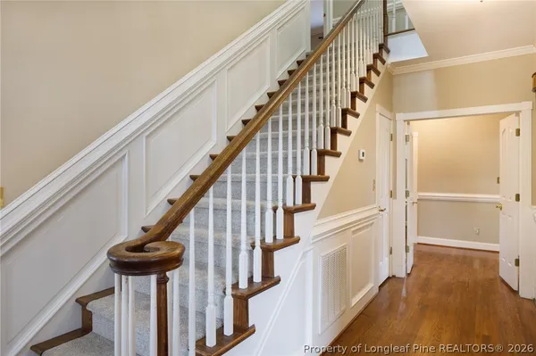 a view of a hallway with stairs