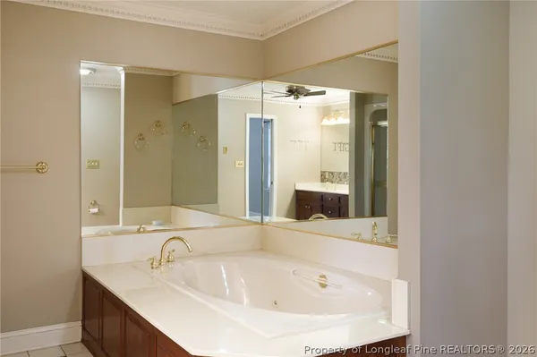a view of a hallway with wooden floor and entryway