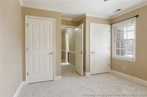 a view of a hallway with a white walls