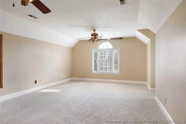 a view of a park with large trees