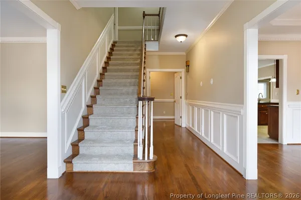 a room with a piano and wooden floor