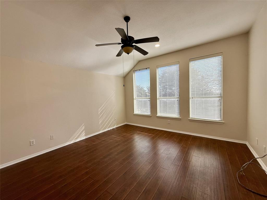 131 Fallkirk Drive Coppell, TX 75019 - Photo 16 of 20 a view of an empty room with wooden floor and a window