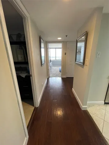 a kitchen with stainless steel appliances kitchen island granite countertop a refrigerator stove and oven