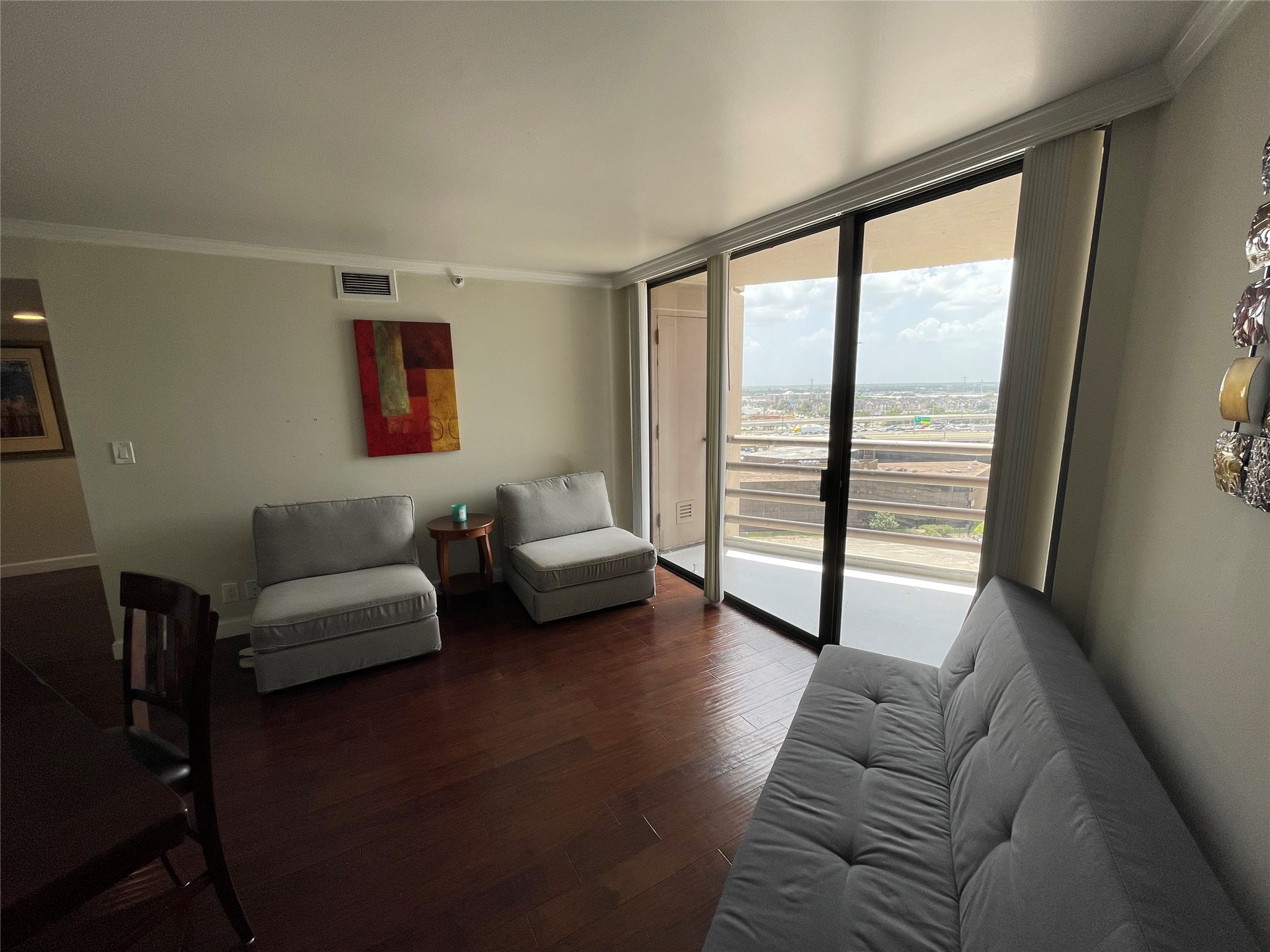 3525 Sage Road, Unit 1401 Houston, TX 77056 - Photo 18 of 22 a living room with furniture and a floor to ceiling window