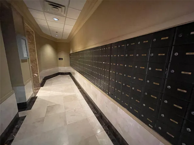 a lobby with furniture and kitchen view