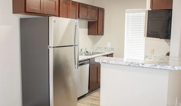 a white refrigerator freezer sitting in a kitchen