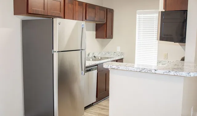 a white refrigerator freezer sitting in a kitchen