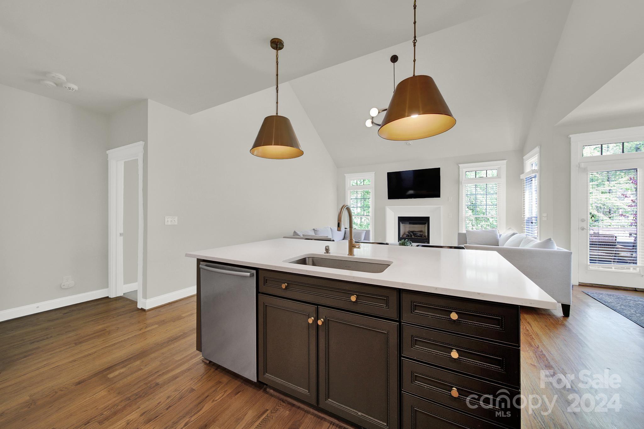 130 Mills Lane Fort Mill, SC 29708 - Photo 14 of 48 a kitchen with a wooden floor and a sink