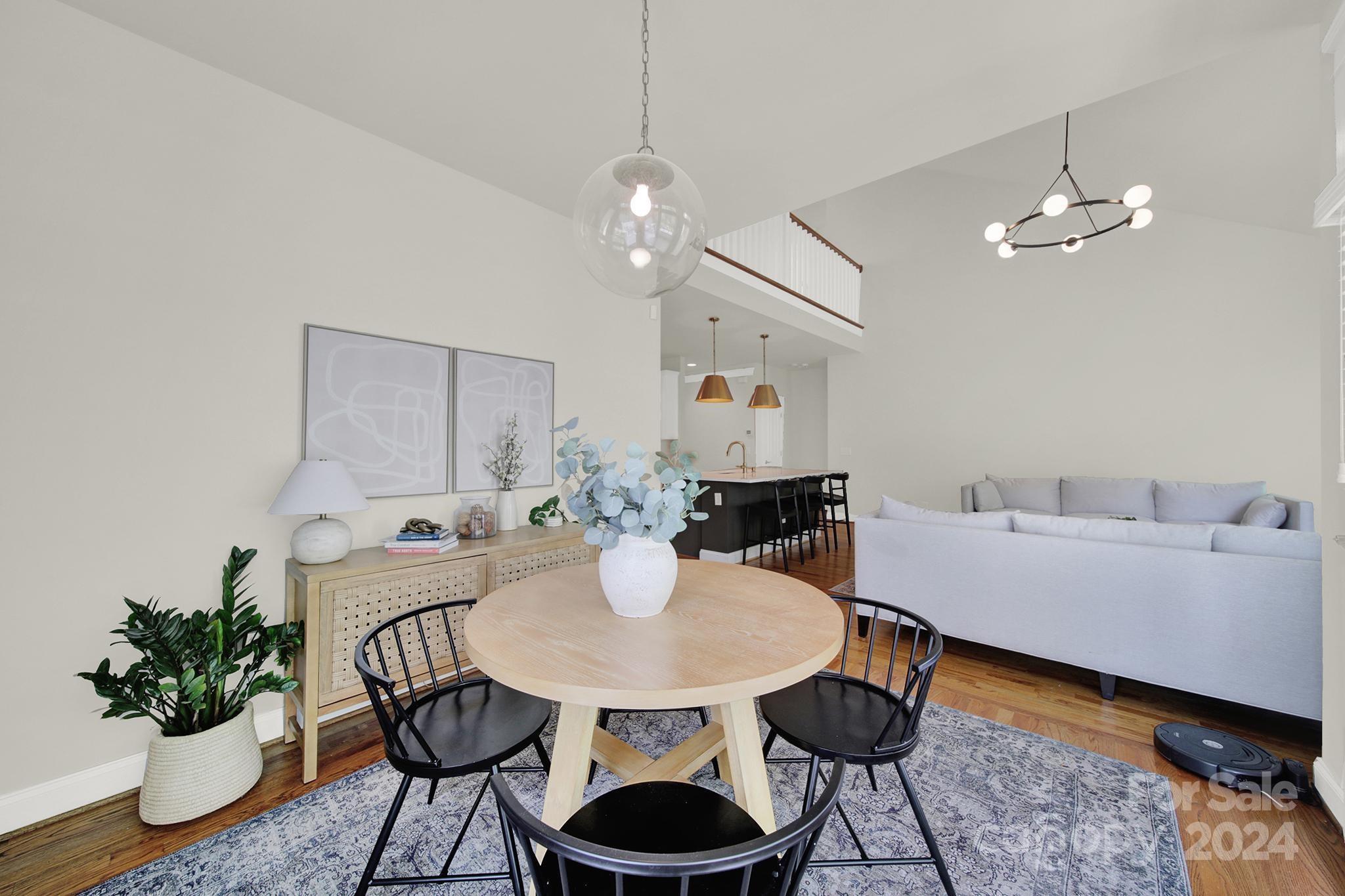 130 Mills Lane Fort Mill, SC 29708 - Photo 19 of 48 a living room with furniture a chandelier and a dining room