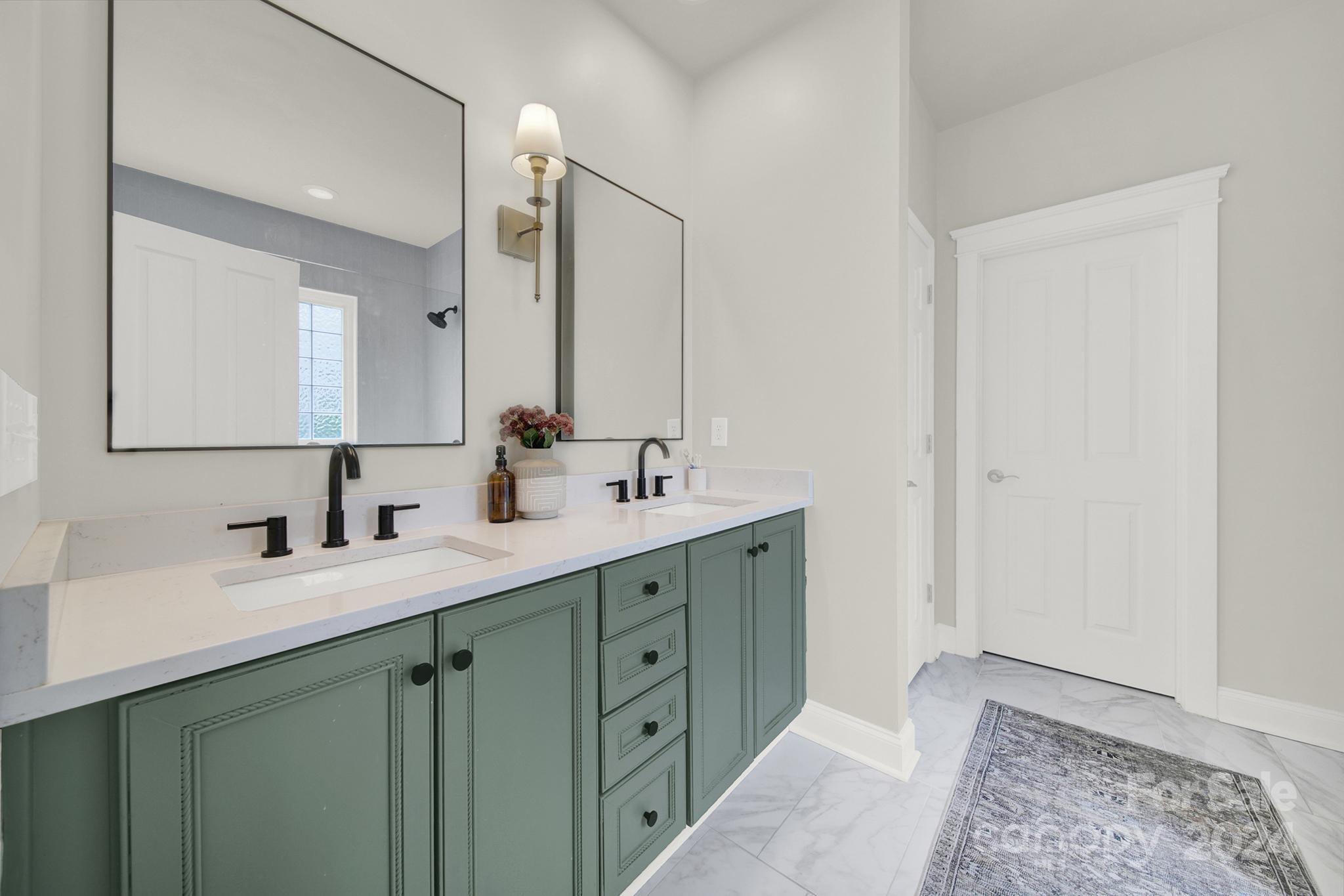 130 Mills Lane Fort Mill, SC 29708 - Photo 25 of 48 a bathroom with a double vanity sink and a mirror