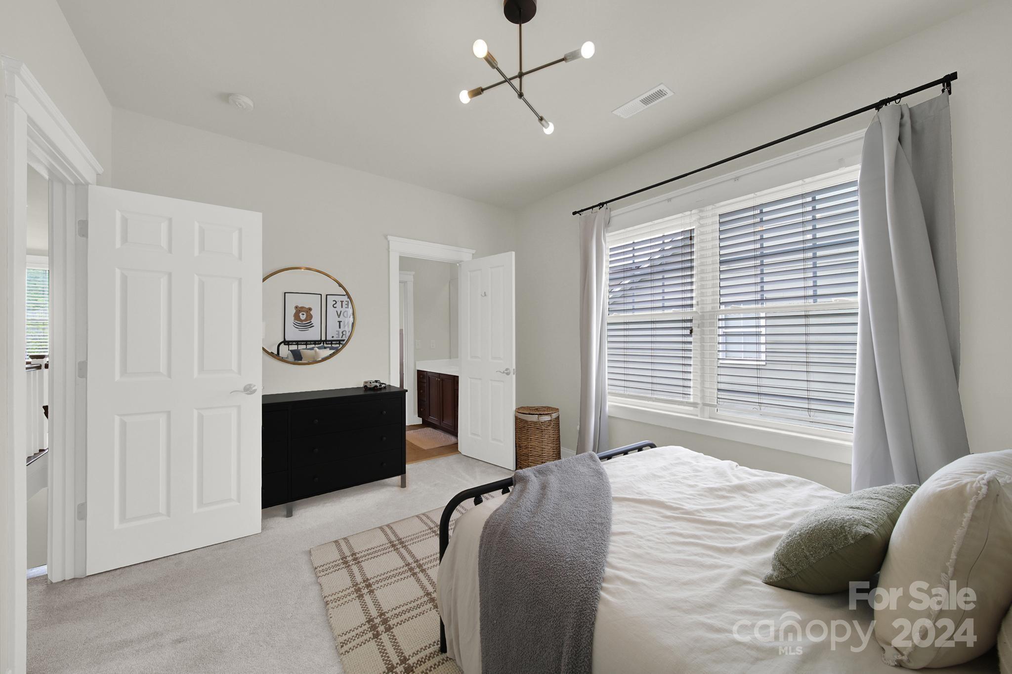 130 Mills Lane Fort Mill, SC 29708 - Photo 30 of 48 a bedroom with a bed and a dresser