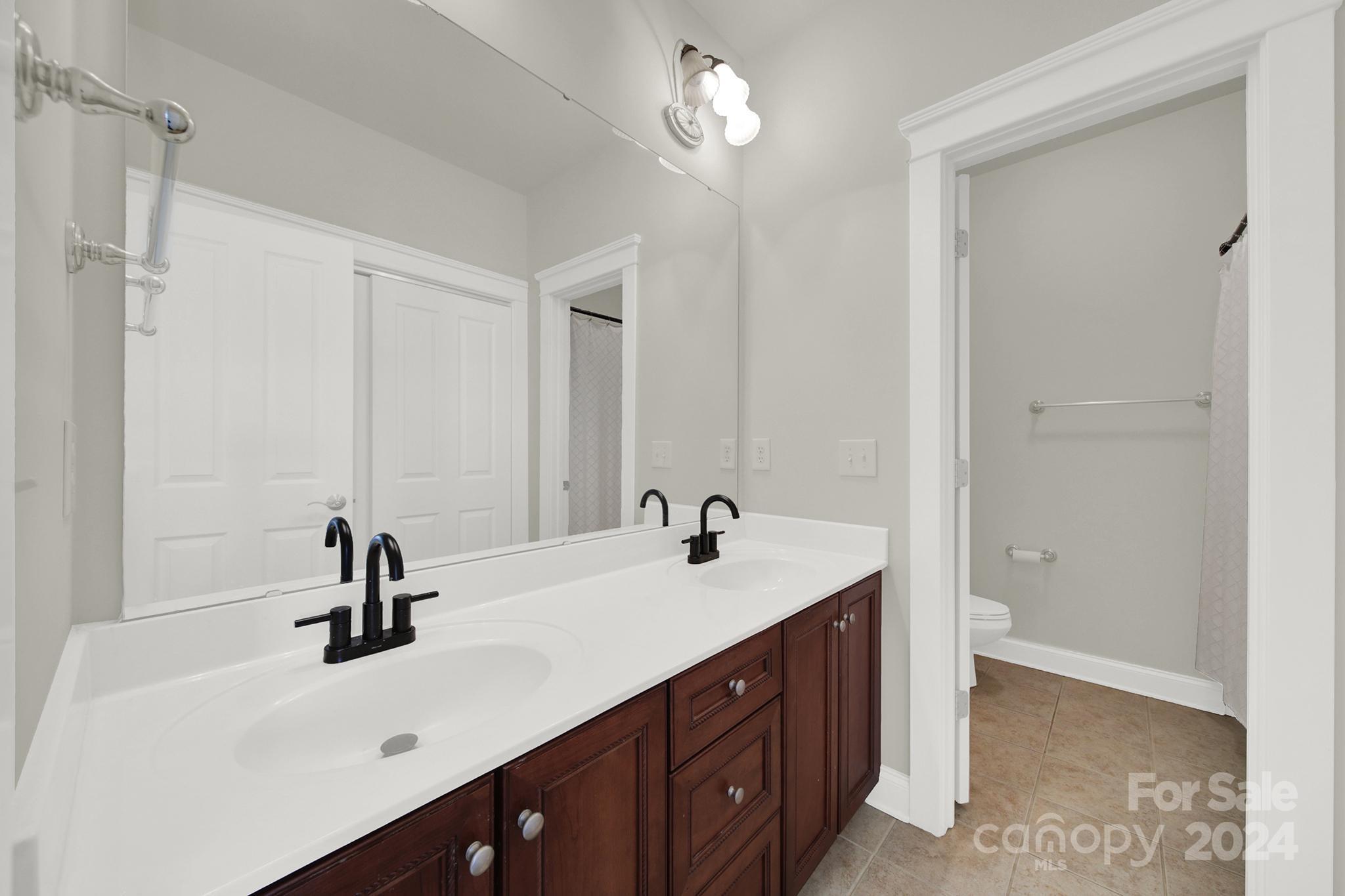 130 Mills Lane Fort Mill, SC 29708 - Photo 36 of 48 a bathroom with a sink and a mirror