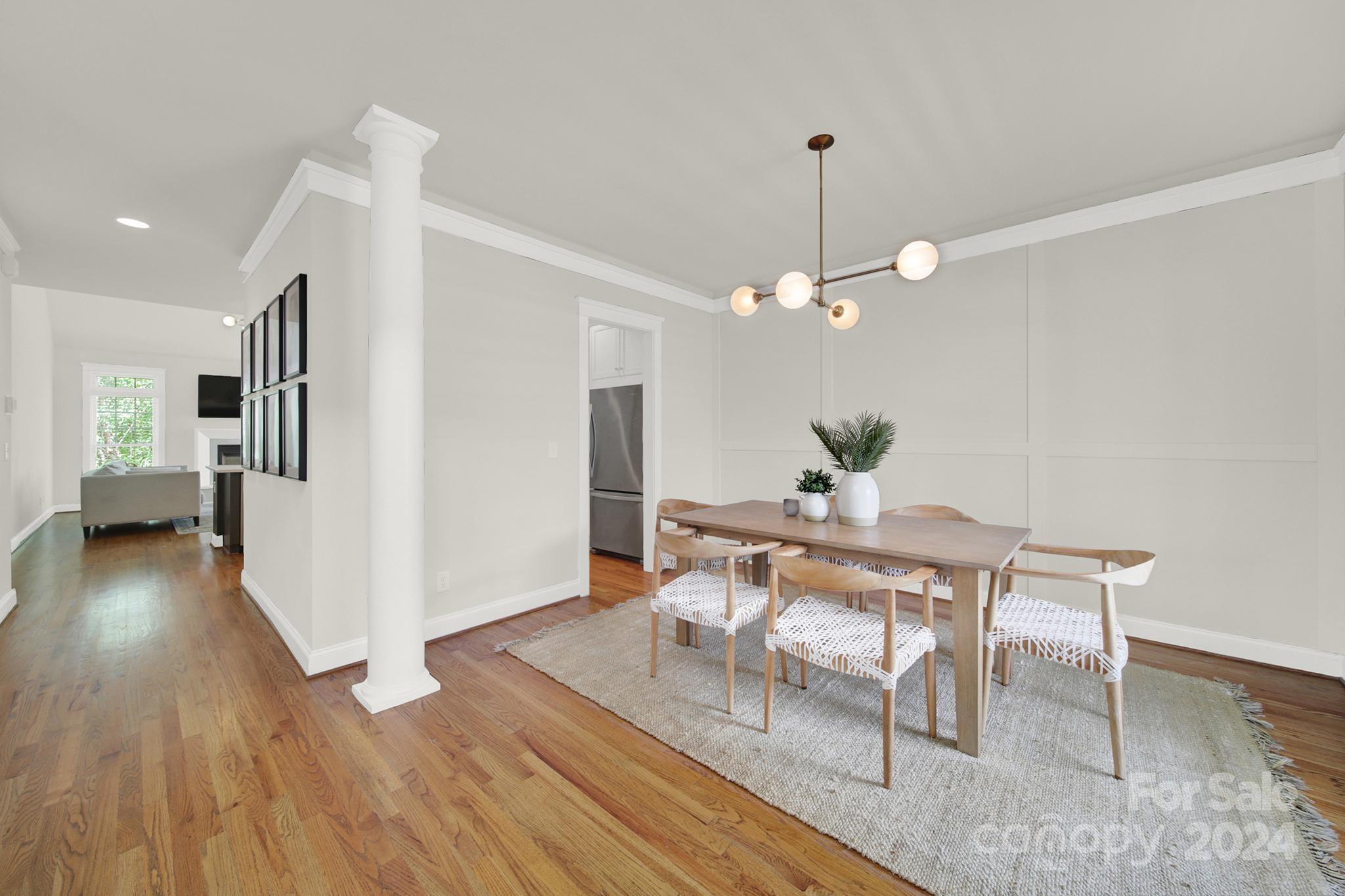 130 Mills Lane Fort Mill, SC 29708 - Photo 4 of 48 a view of a dining room with furniture and wooden floor