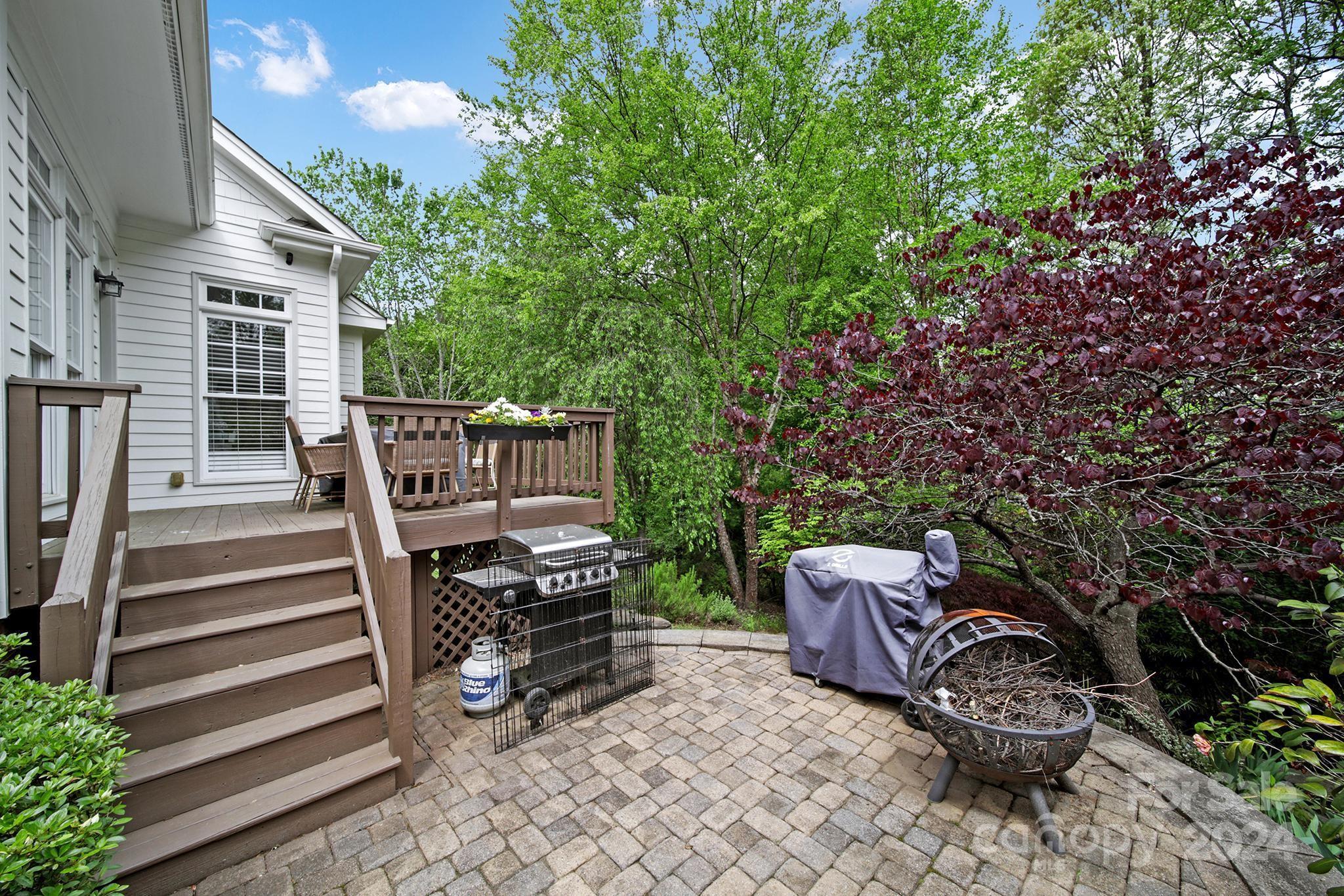 130 Mills Lane Fort Mill, SC 29708 - Photo 41 of 48 a backyard of a house with fountain table and chairs