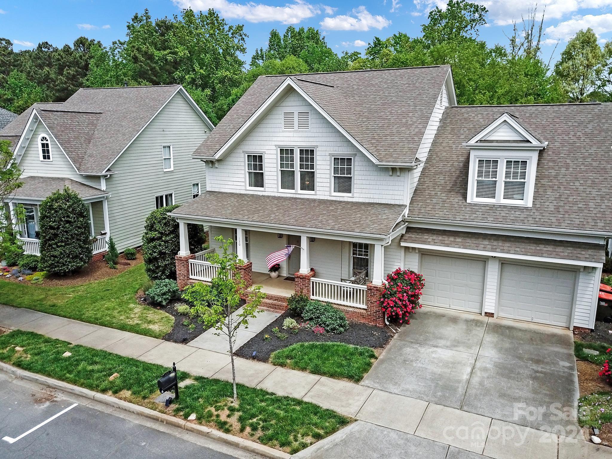 130 Mills Lane Fort Mill, SC 29708 - Photo 45 of 48 a front view of a house with a yard and outdoor seating