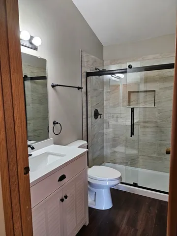 a bathroom with a double vanity sink and mirror