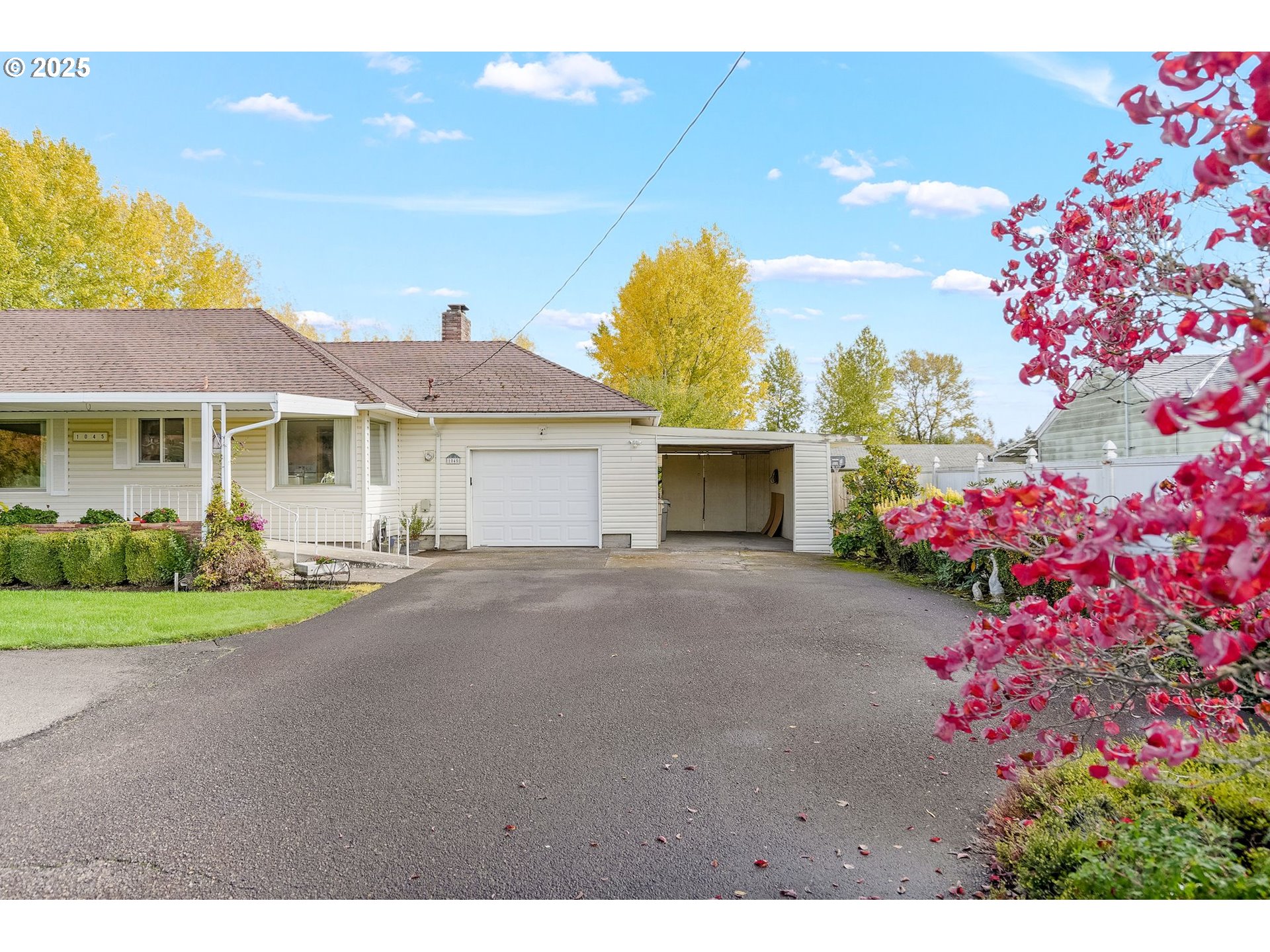 1045 Southwest 53rd Street Corvallis, OR 97333 - Photo 16 of 48 a front view of a house with a yard and garage