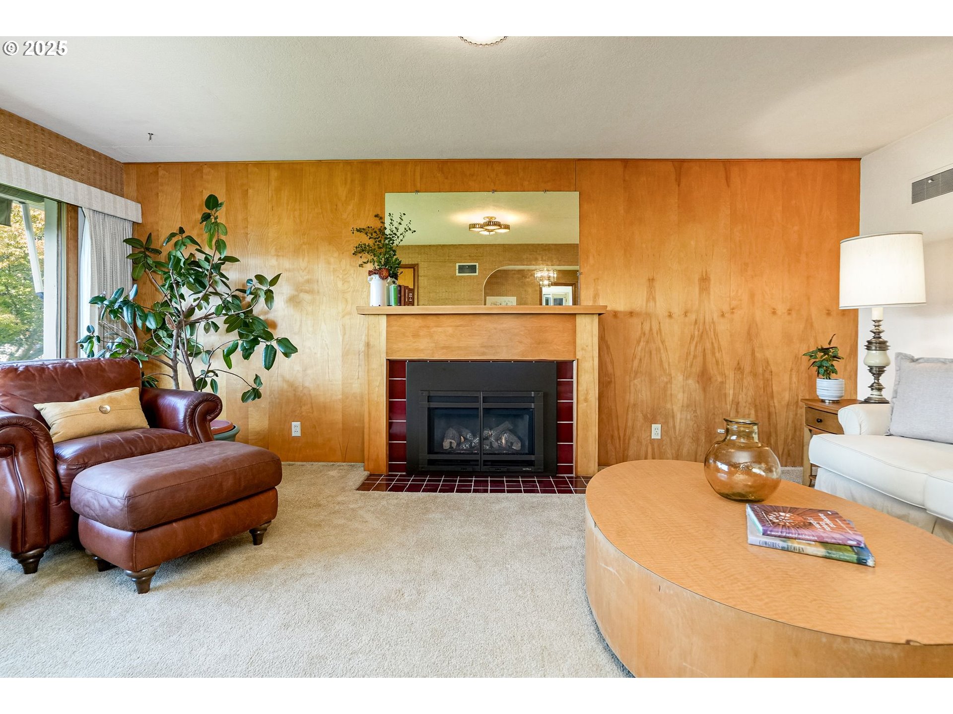 1045 Southwest 53rd Street Corvallis, OR 97333 - Photo 21 of 48 a living room with furniture a fireplace and a flat screen tv