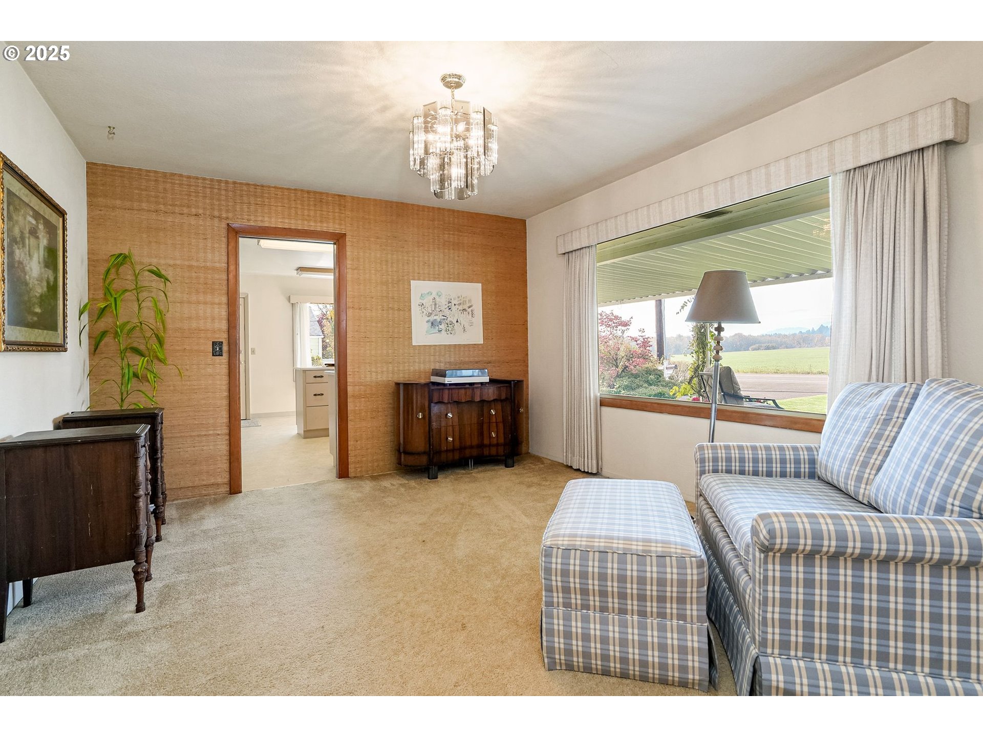 1045 Southwest 53rd Street Corvallis, OR 97333 - Photo 25 of 48 a living room with furniture and a chandelier