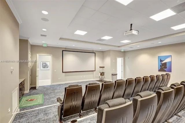 a media room with lots of chairs and a projector screen